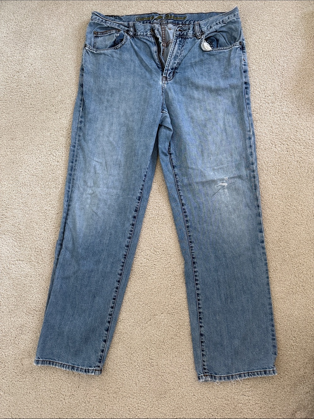 Tommy Bahama Men's Light Blue Straight Jeans. Slightly distressed.
